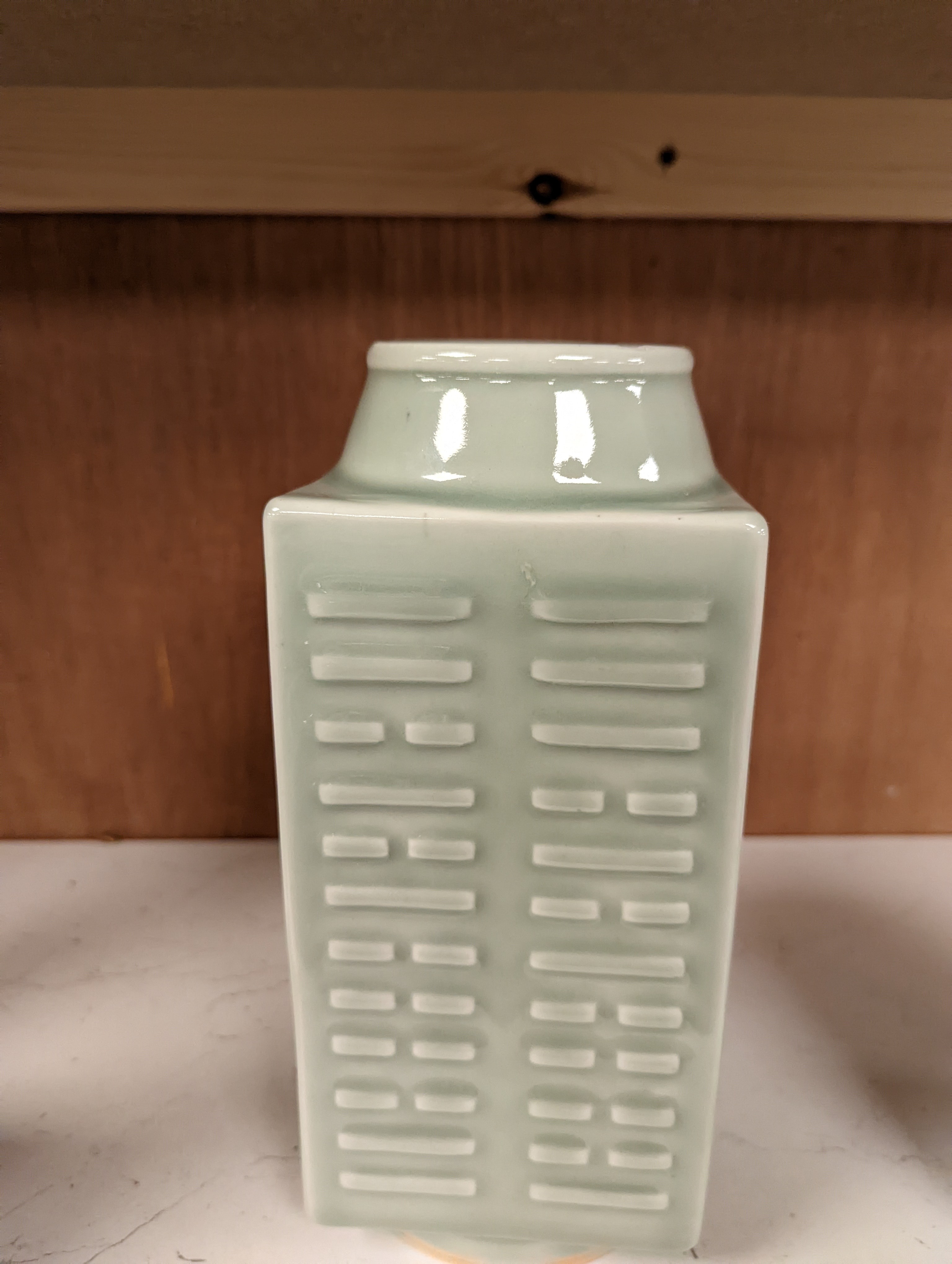 A Chinese celadon glazed eight trigrams cong shaped vase, Guangxu mark and possibly of the period. Provenance - owner bought in auction 20 years ago. 25cm tall